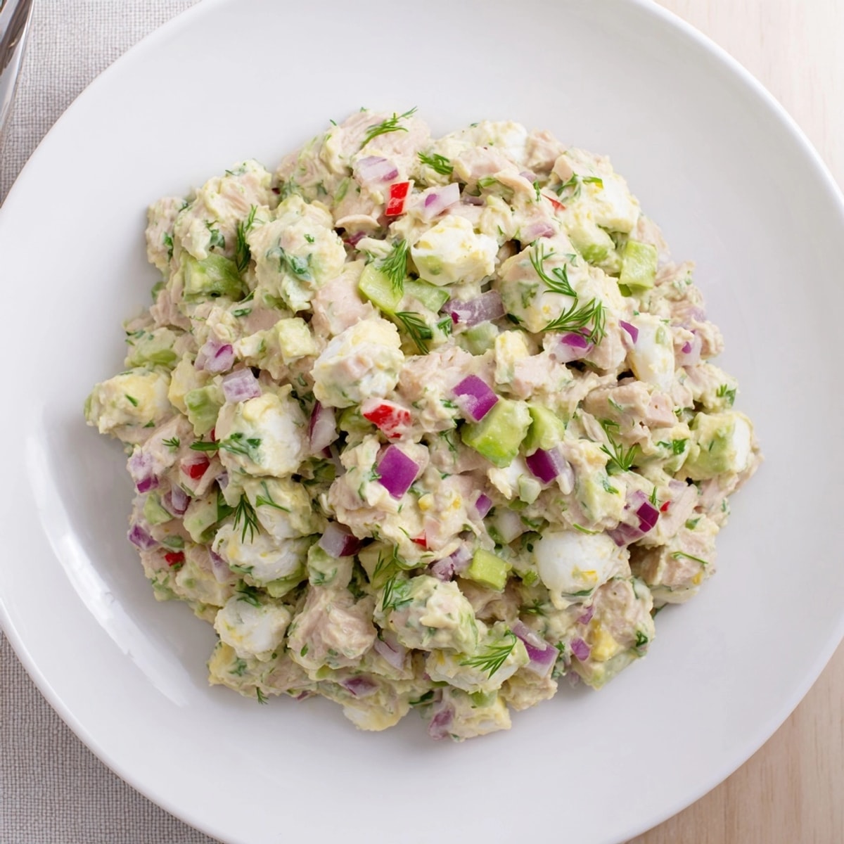 Creamy Avocado Ranch Tuna Egg Salad, ready to be served on toasted whole-wheat bread.