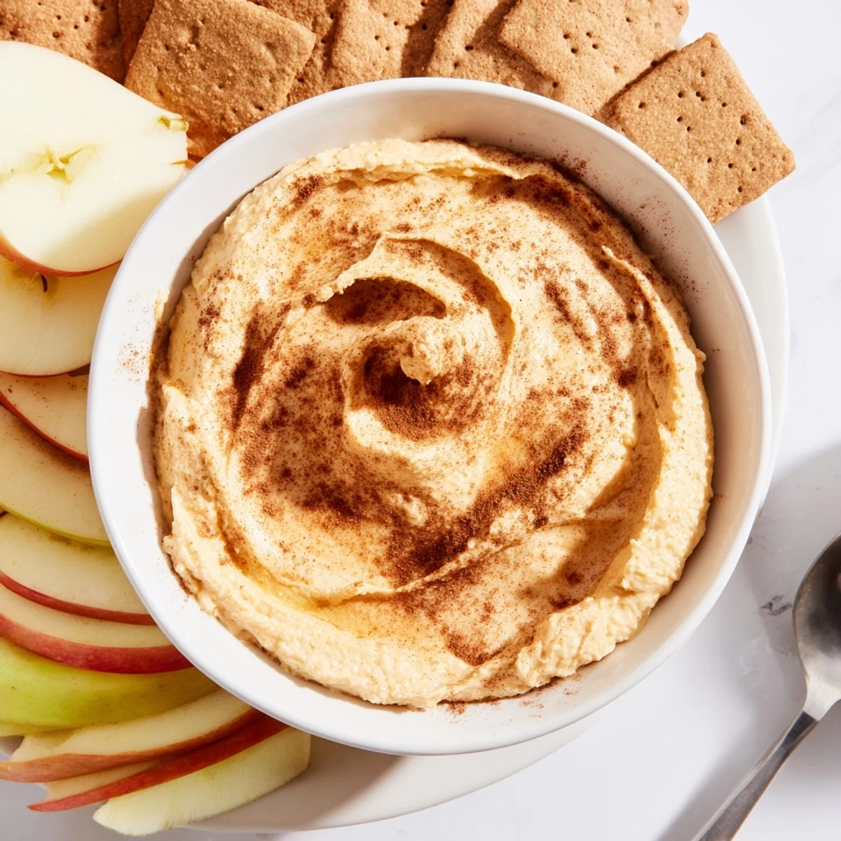 Delicious pumpkin pie dip with warm spices, perfect for holiday gatherings.  