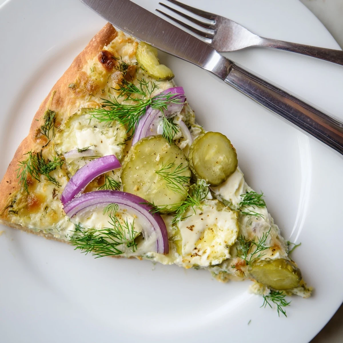 Golden-baked Pickle Pizza with fresh dill, a flavor adventure on a crispy crust.