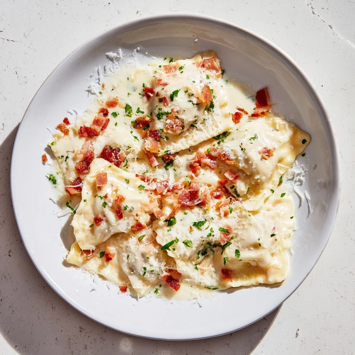 Golden Olive Garden Ravioli Carbonara, swimming in a rich, creamy sauce with crispy pancetta pieces.
