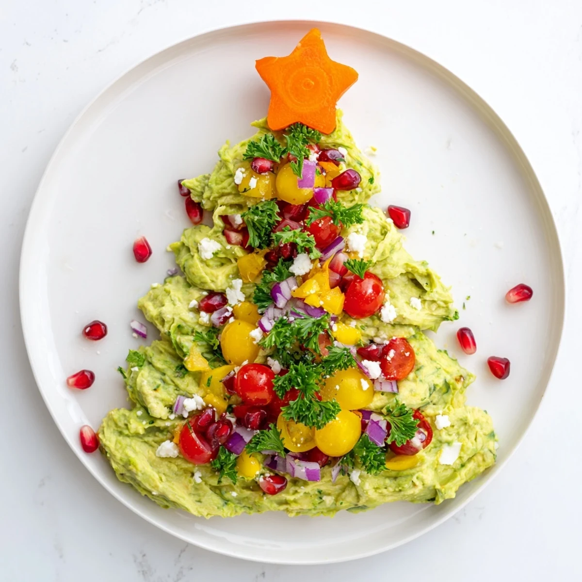 Creamy Whipped Avocado Christmas Tree Dip, beautifully decorated and ready to scoop with chips.