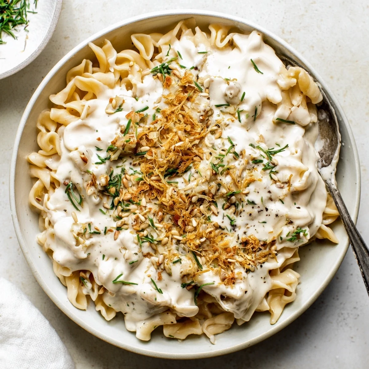 Creamy miso ditalini, a bowl of rich pasta coated in velvety sauce, ready to serve with scallions.