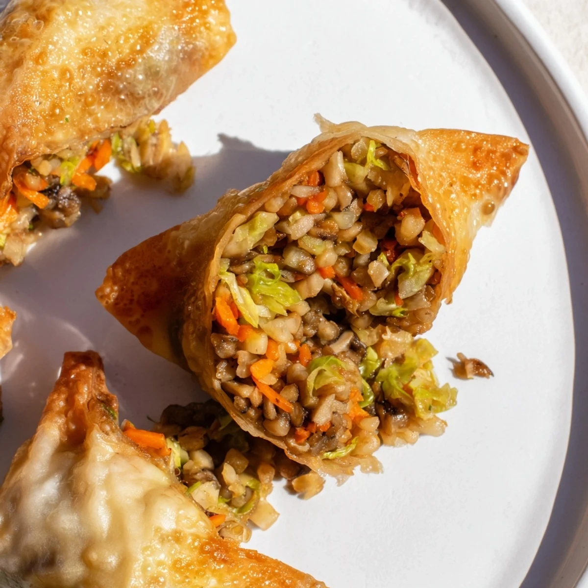 Golden, crispy Crispy Rice Paper Dumplings, a delightful vegan appetizer with flavorful fillings, perfect for sharing.