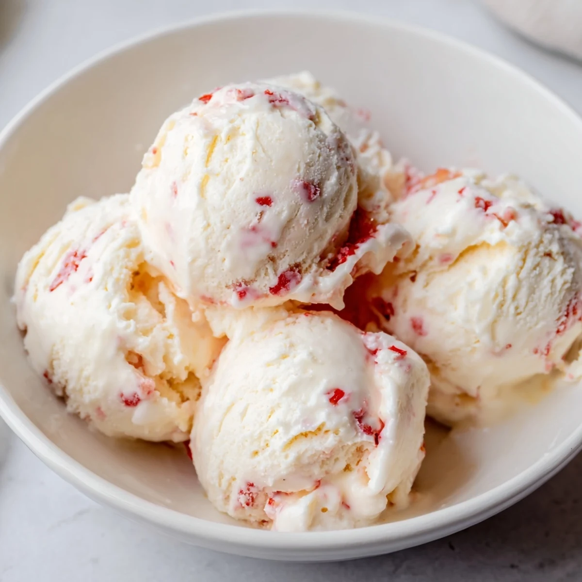 Homemade cottage cheese ice cream with chocolate chips, a sweet treat ready to scoop and enjoy.