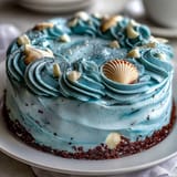 Moist vanilla Cancer Zodiac Cake with dreamy blue buttercream and sea treasures.