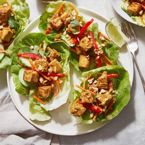 Close-up of vibrant Thai Peanut Tofu Lettuce Wraps; fresh, crunchy, and ready to eat.