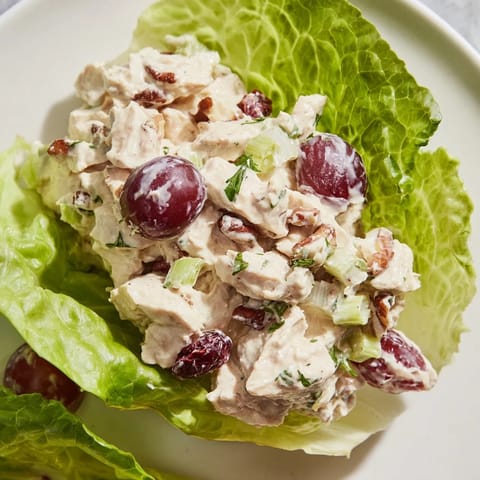 A close-up of colorful Festive Chicken Salad Cups, ready to eat, perfect for your next party.