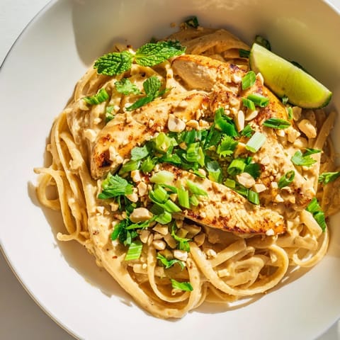 A delicious bowl of steaming Thai Peanut Chicken Pasta, ready in under 35 minutes!