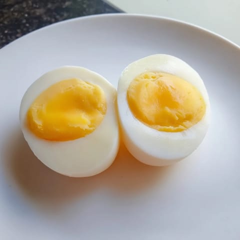 Golden-yellow Air Fryer Boiled Eggs, a satisfying breakfast or snack option for everyone.