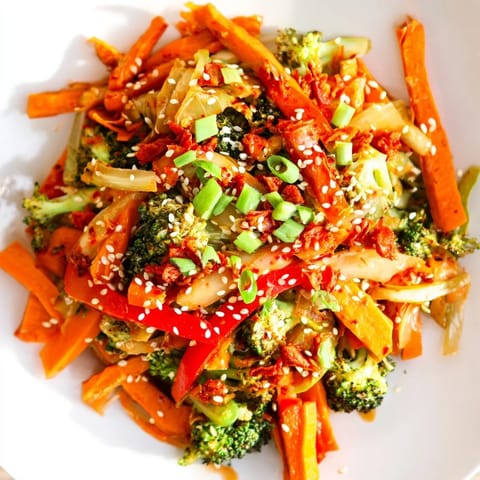 A bowl of fermented veggie stir-fry garnished with sesame seeds and fresh green onions.