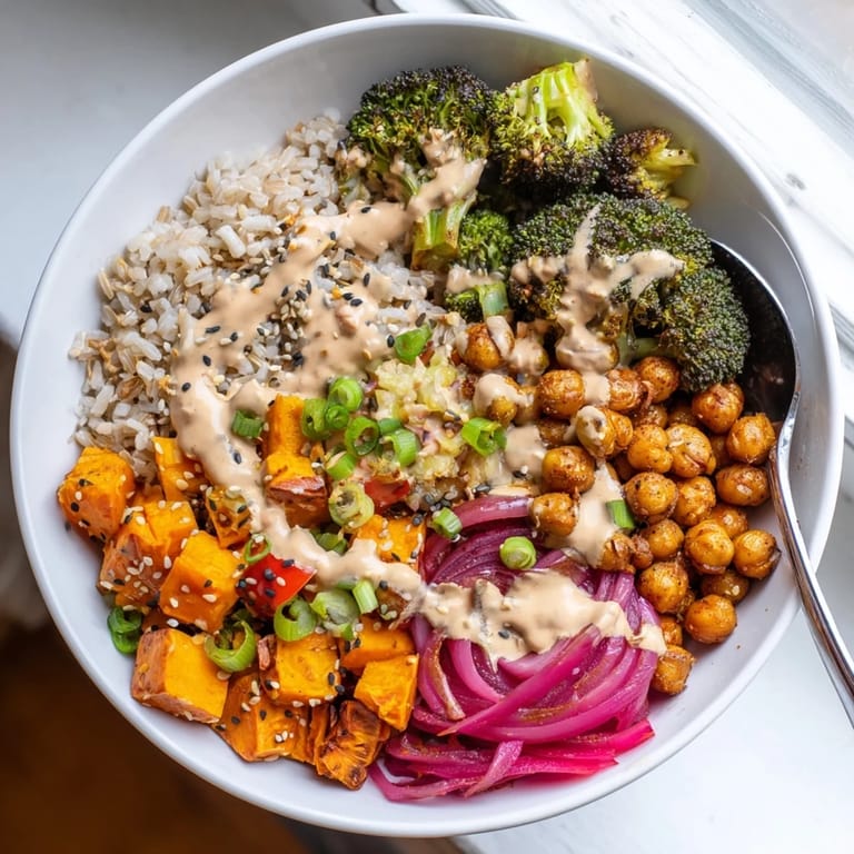 Hearty Bold Sauce Drizzle Bowls with chickpeas, roasted vegetables, and two zesty sauces.