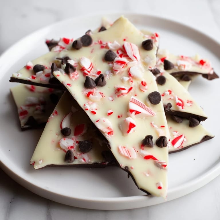 Crisp shards of Peppermint Bark, glistening with crushed peppermint, perfect for sharing and easy to make.