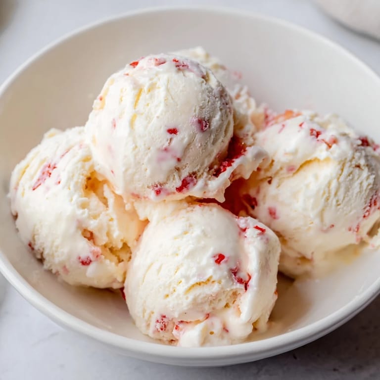 Homemade cottage cheese ice cream with chocolate chips, a sweet treat ready to scoop and enjoy.