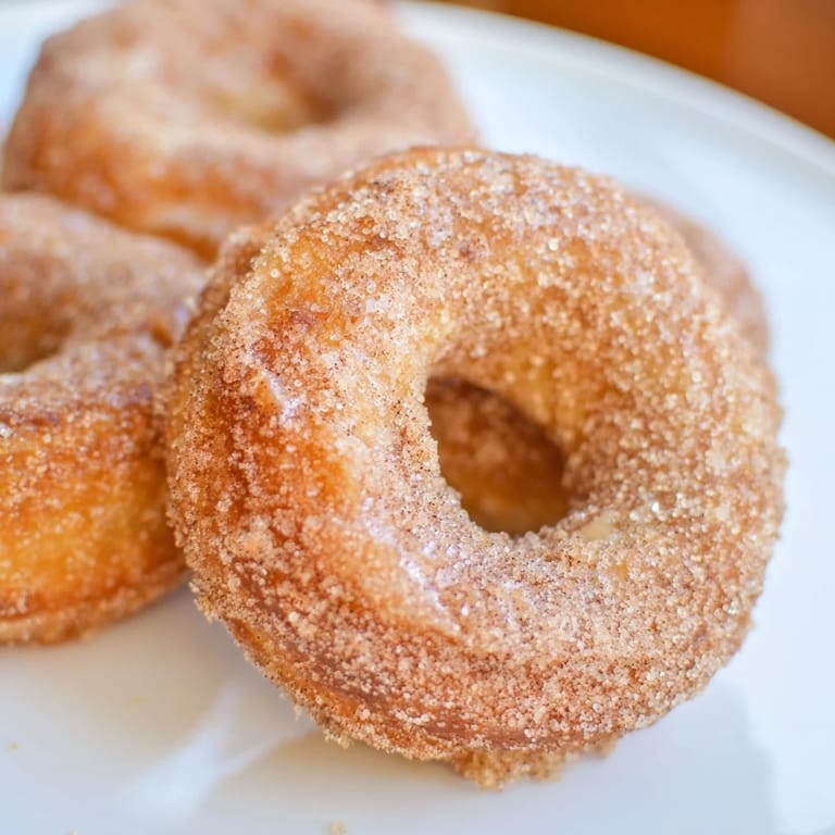 Fluffy and warm, these 1-Minute Air Fryer Donuts are a delicious shortcut breakfast ready in minutes.